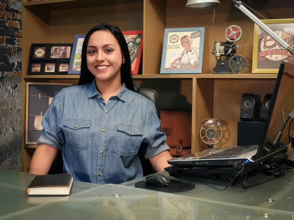 Smiling author sitting at her desk