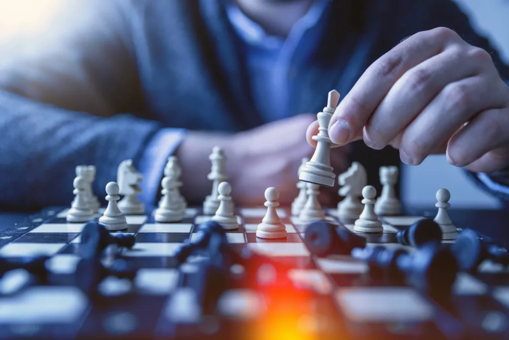 Player moving a chess piece on a board