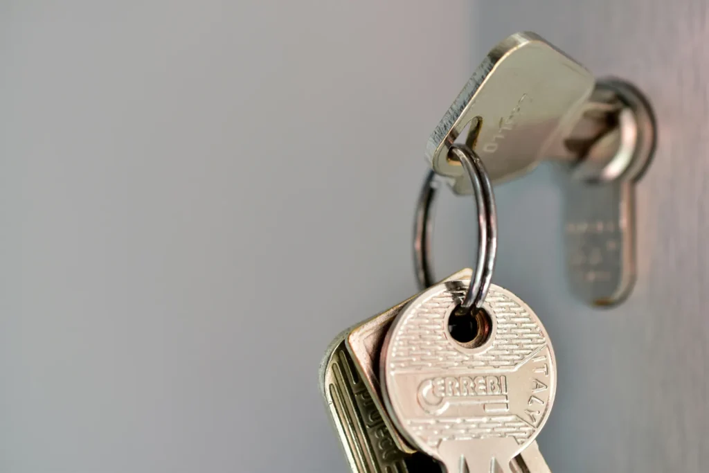 Bunch of keys hanging from a door lock