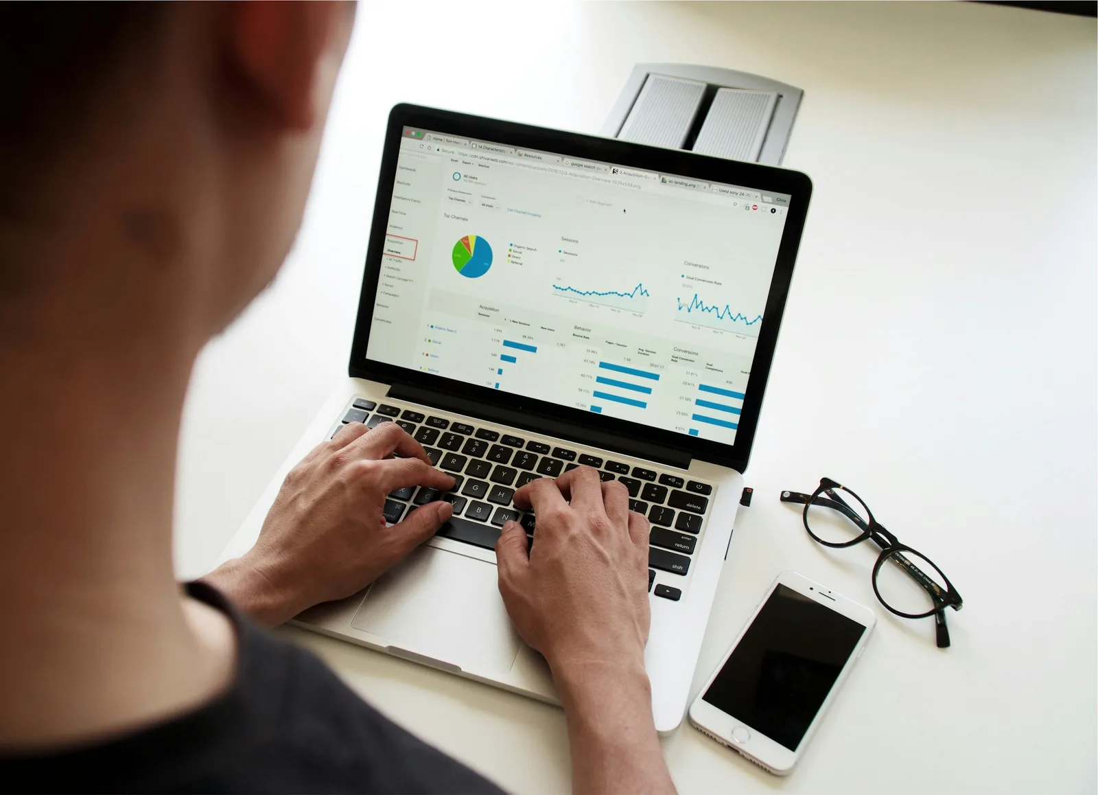 Person reviewing an ads dashboard on a laptop