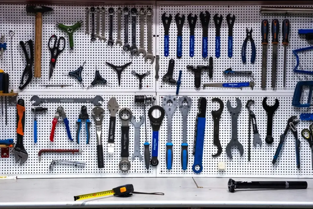 Hand tools arranged on a pegboard wall