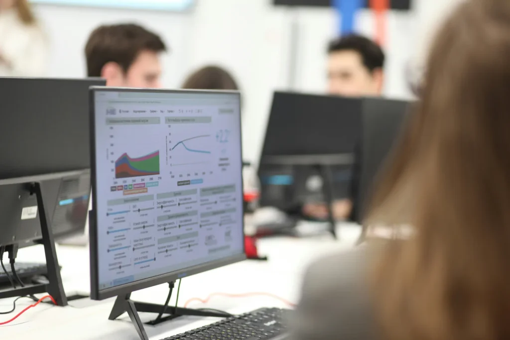 Monitor showing website performance charts in an office